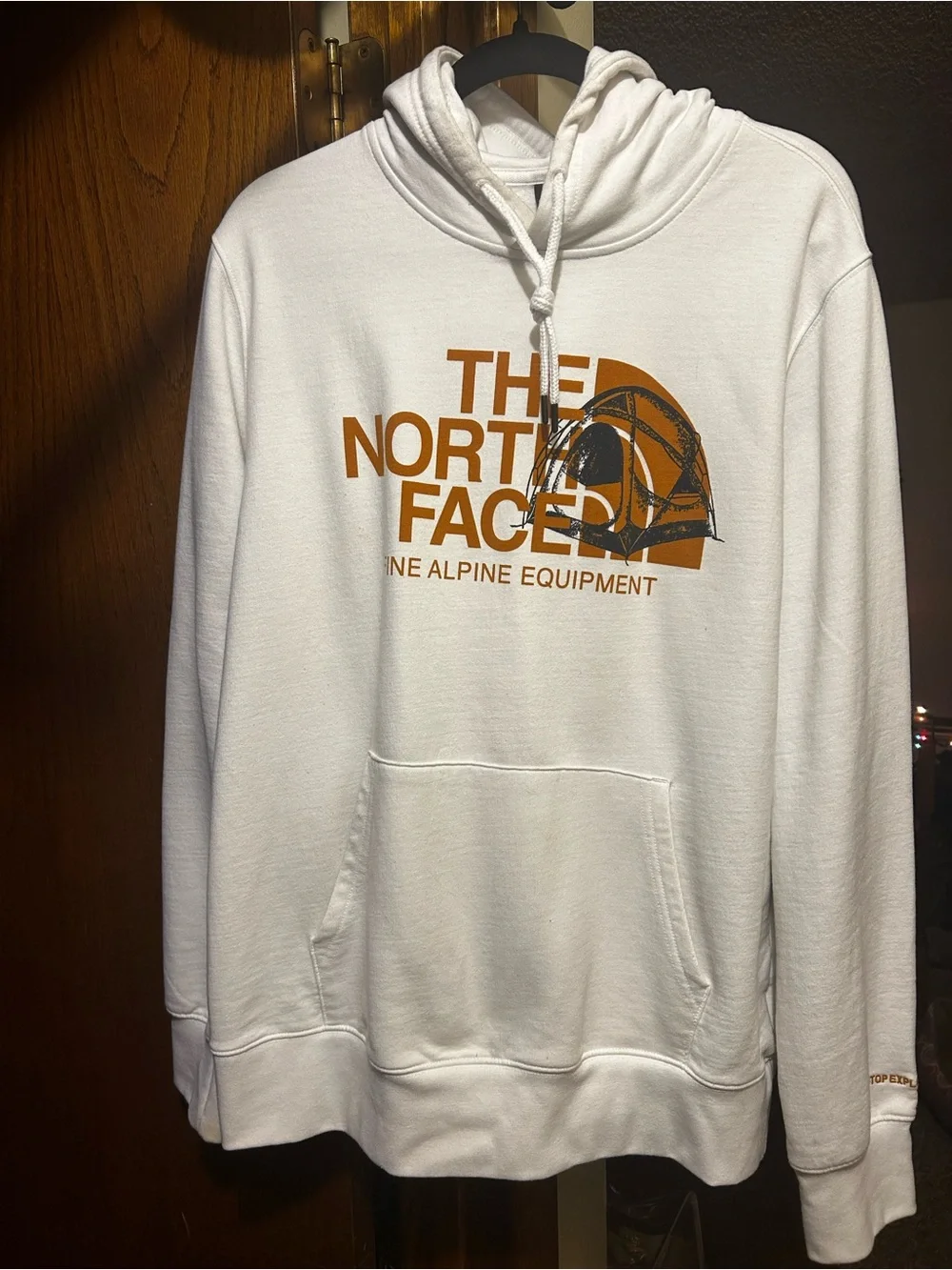 The North Face White Hoodie with Rust Logo